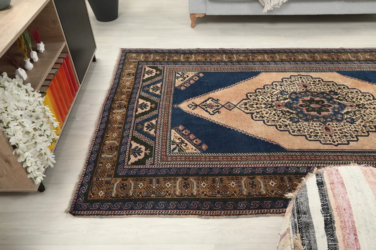 View of the rug from the side in a living room, capturing its full length and design