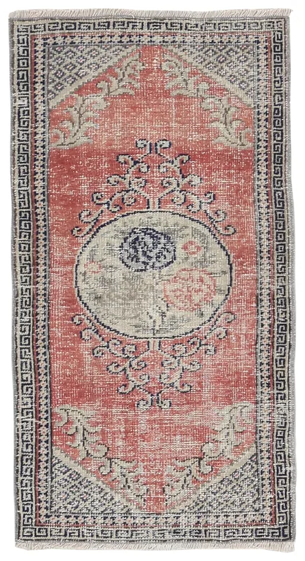 Top-down view of the 2x5 vintage Anatolian rug with a rose field and navy geometric medallion.