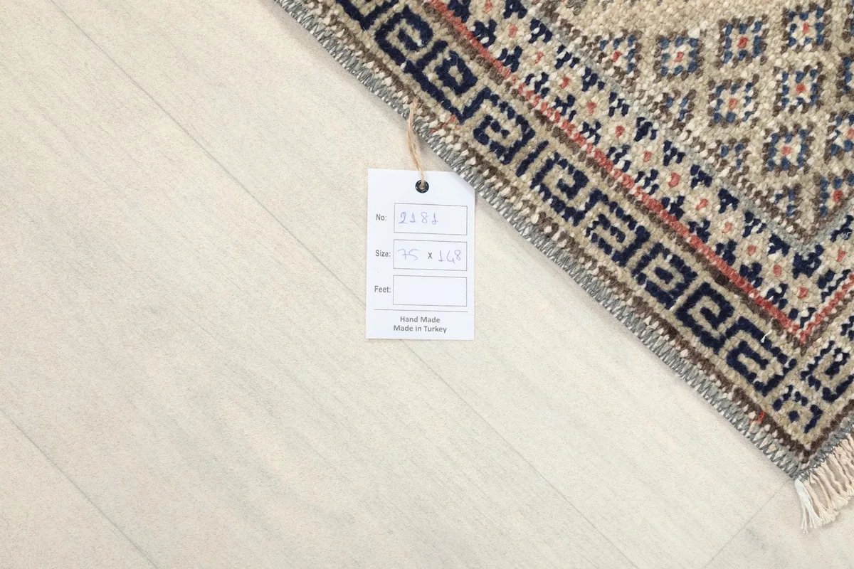 Corner of the rug with the product tag, displaying size and origin information.