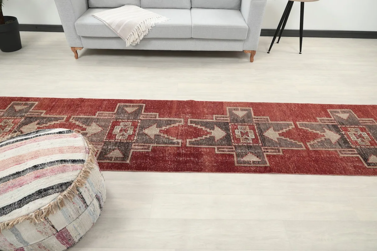 Perspective shot of the runner rug in a room, emphasizing its length and the surrounding decor