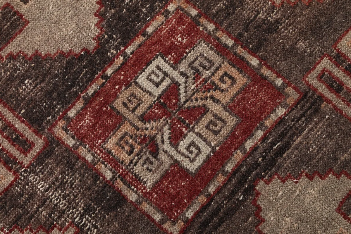 Macro detail of the intricate weaving and colors within a geometric design element