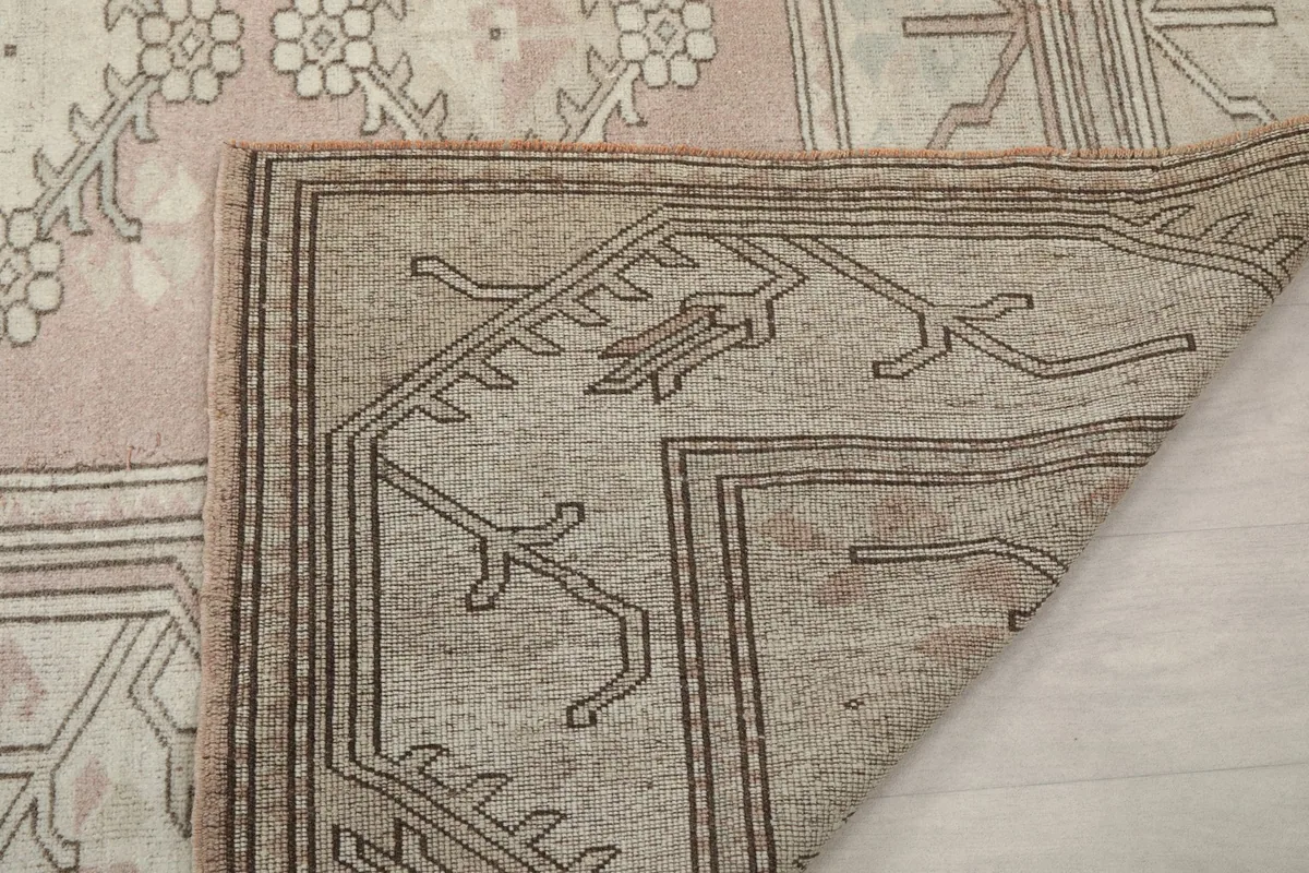 Close-up of the back of the hand-knotted rug, revealing the foundation