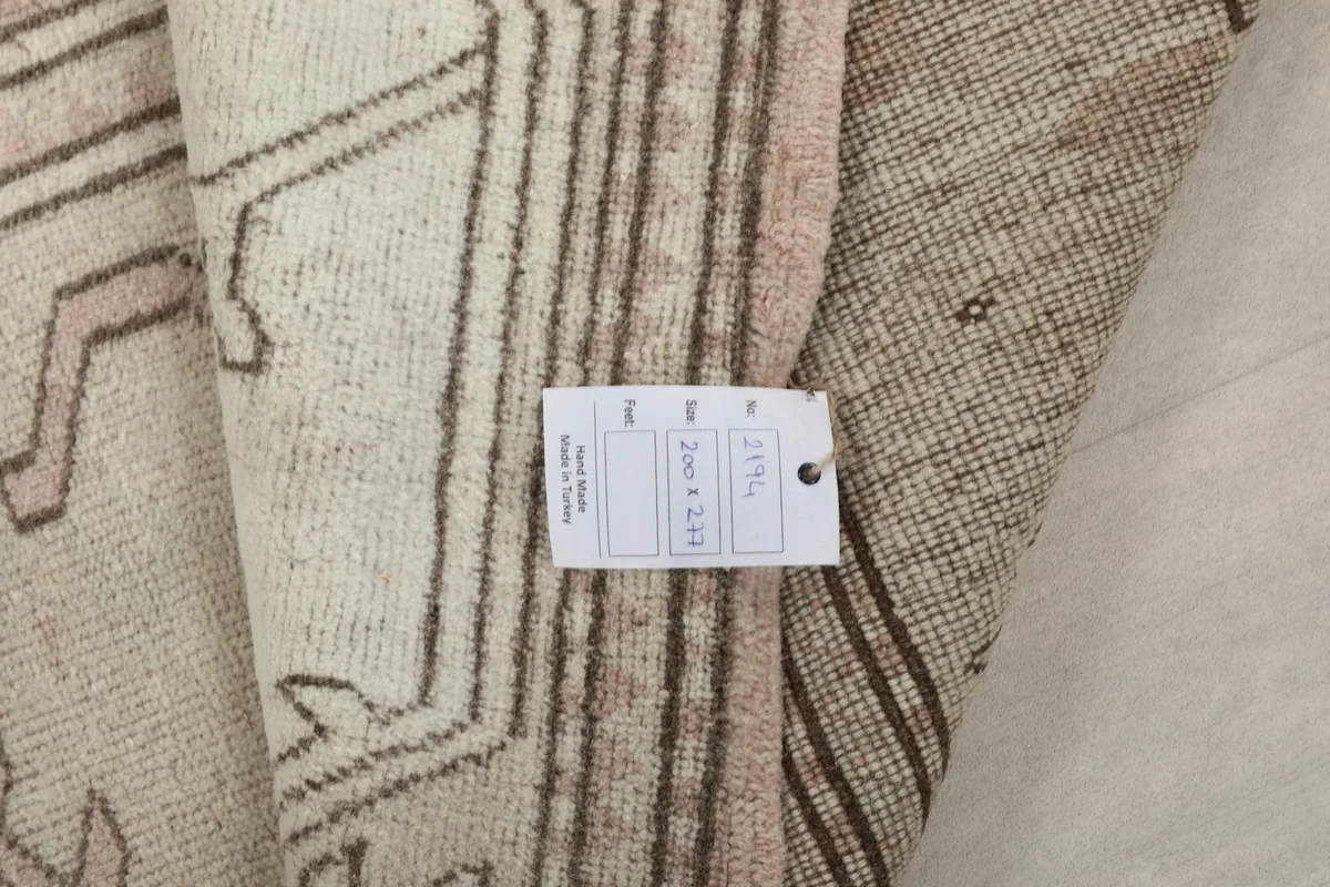 Product tag attached to the rug, showing size and origin details