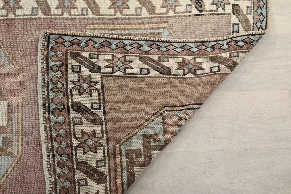 Another folded corner view, showing the reverse side and the hand-knotted structure