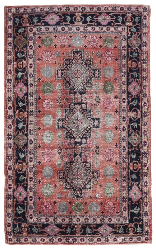 Full top view of the 4x6 vintage Anatolian rug on a white background, showcasing its rust field and navy border.