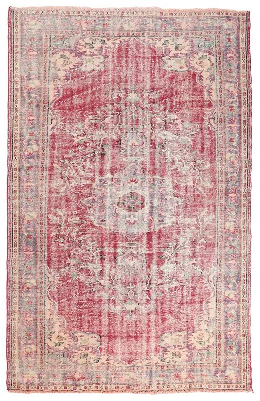 Full top view of the 6x9 rose medallion floral vintage Anatolian area rug on a white background.