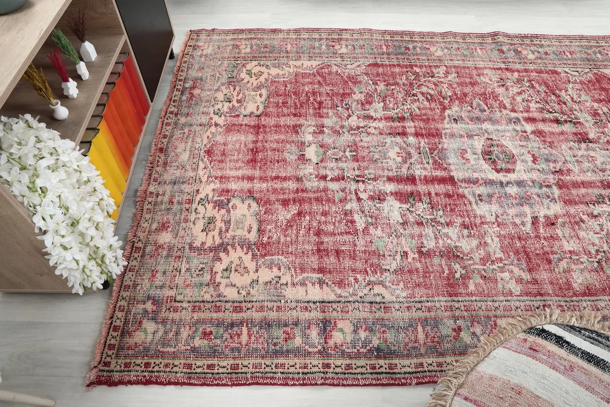 Wide angle view of the rug in a room, emphasizing its medium size and how it anchors the space.