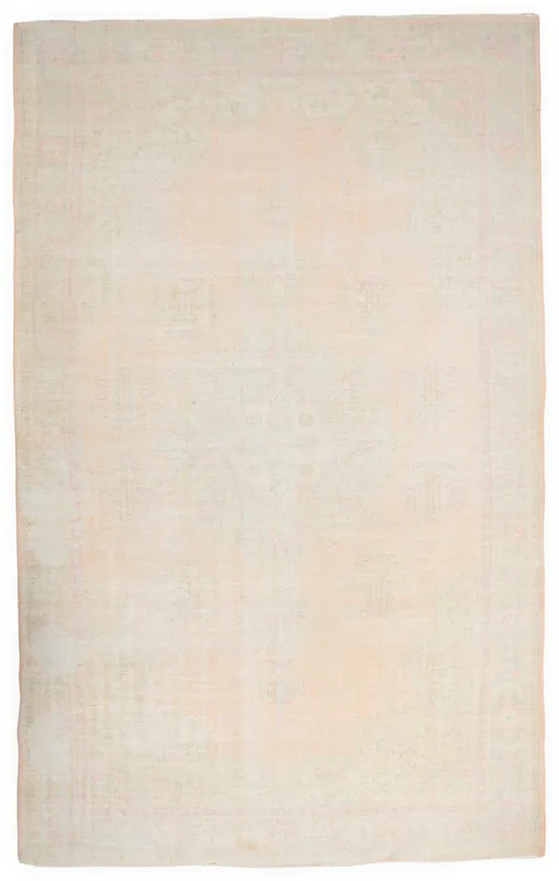 Full top view of the beige and rose vintage Anatolian rug on a white background