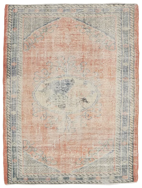 Full top view of the 4x5 vintage Anatolian rug with a faded rust field and blue medallion