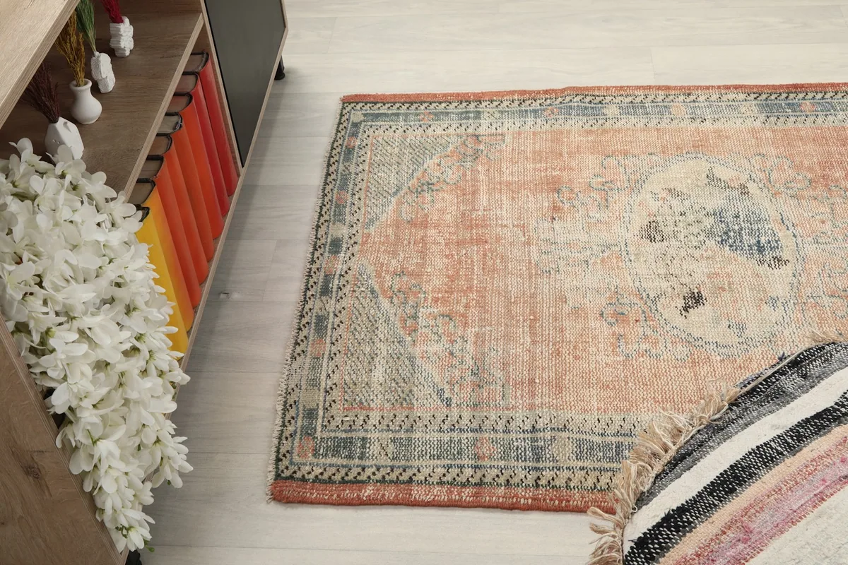 Diagonal view of the rug on the floor, capturing the overall pattern and color variations