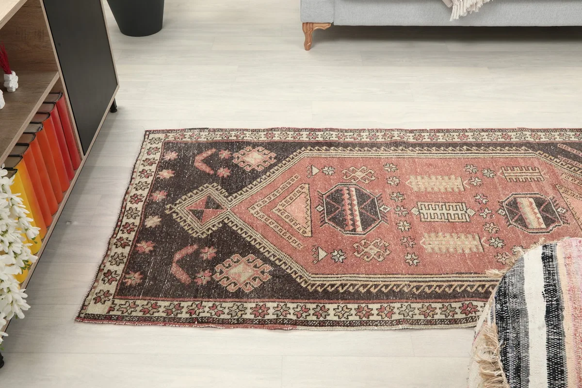 Runner rug placed in a room setting, viewed from a side angle, showing its integration with decor