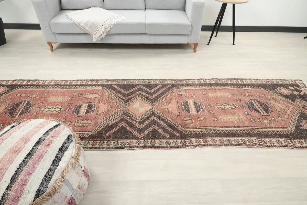 View of the vintage runner rug stretching across a hallway, emphasizing its length