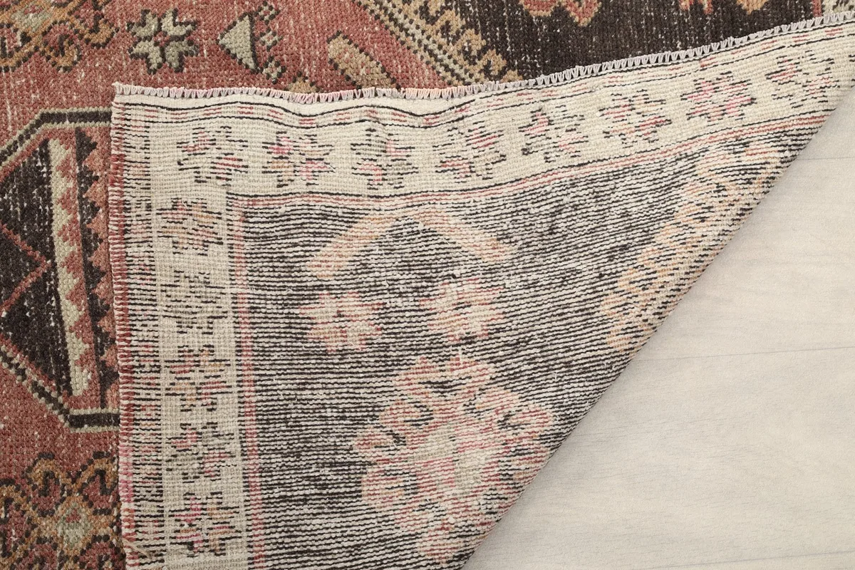 Close-up of the back of the rug, showing the knotting structure and foundation