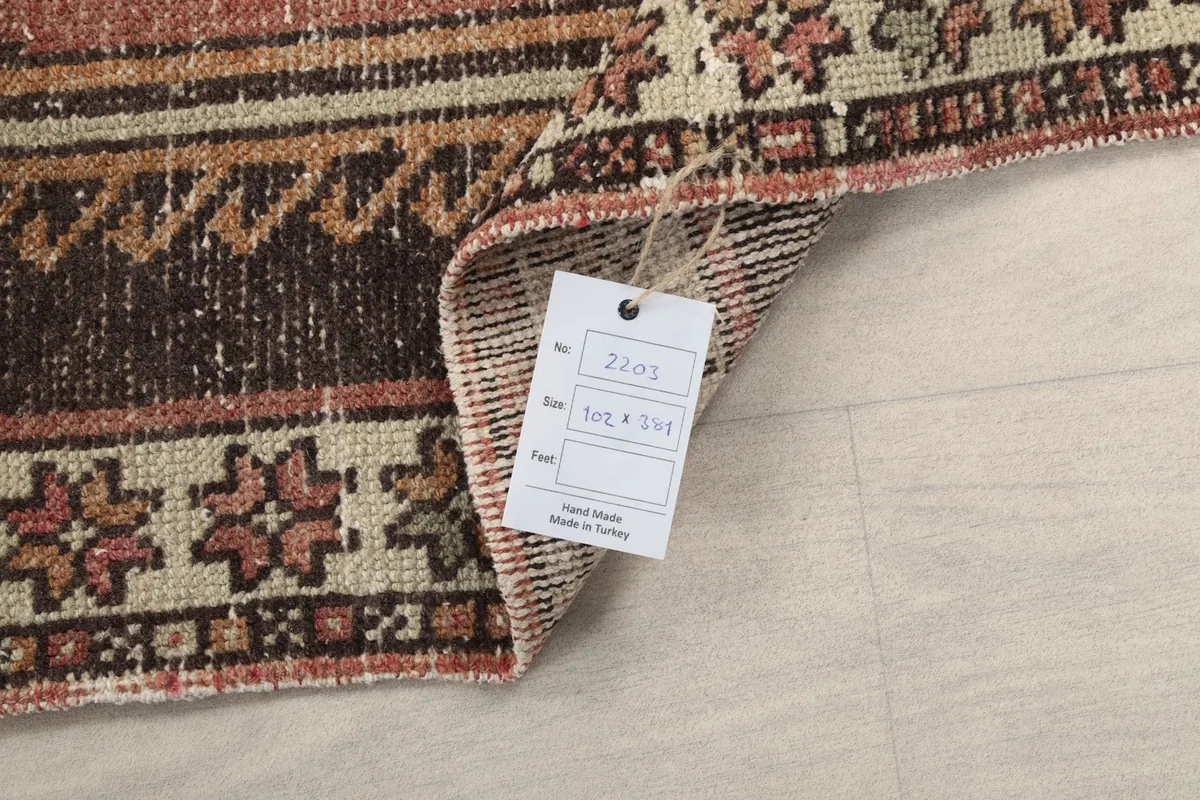 Corner of the rug with a tag displaying product information and origin
