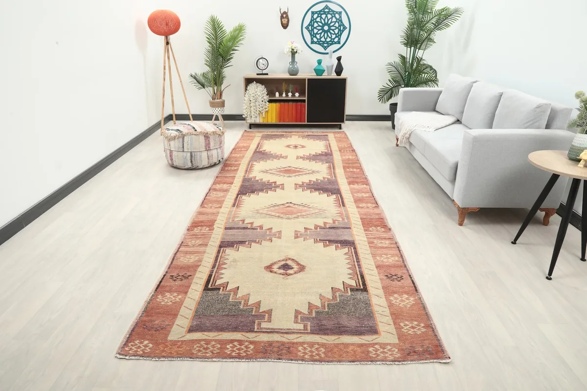 Vintage Anatolian runner rug displayed in a modern hallway setting with light wood floors and neutral furniture.
