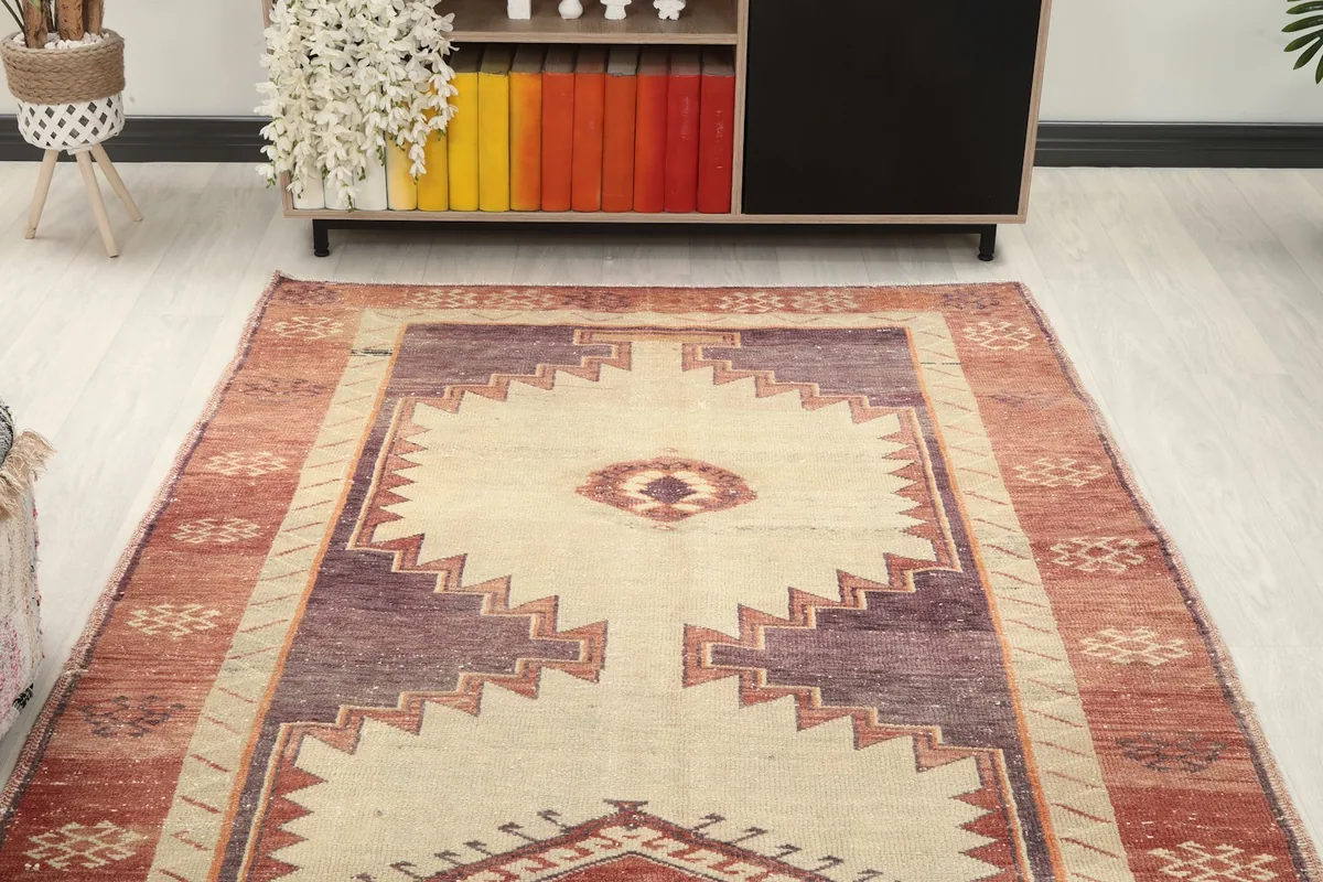 Overhead view of a section of the runner rug, showcasing the repeating tribal geometric motifs.
