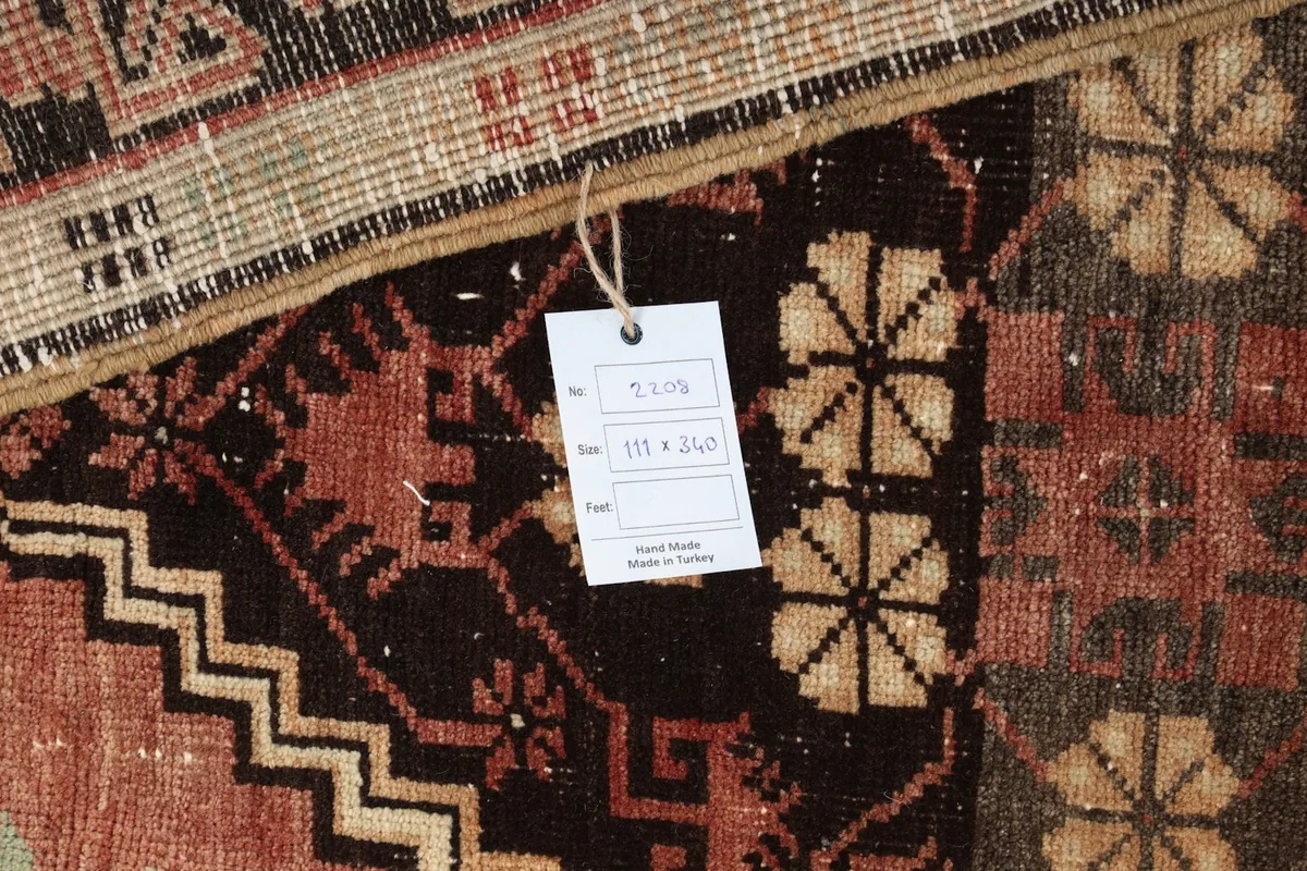 Close-up of the rug's backing and a small tag with size and origin information