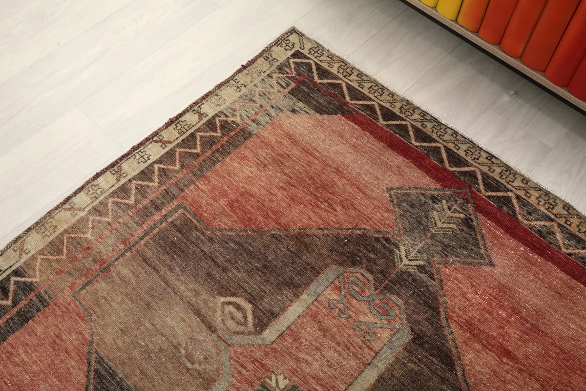Corner perspective of the rug, emphasizing the hand-knotted wool pile and border design