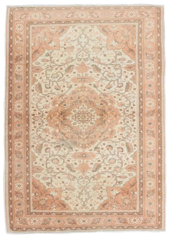 Full overhead view of the cream and rust vintage Anatolian area rug with a central medallion.