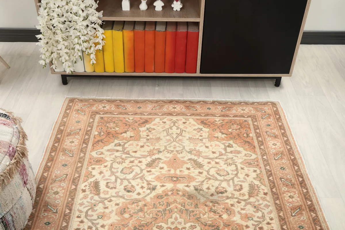 View of the rug in a room, showing its full length from a slightly elevated perspective.