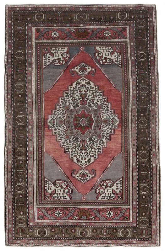 Full overhead view of the vintage Anatolian wool rug with a rose and gray medallion