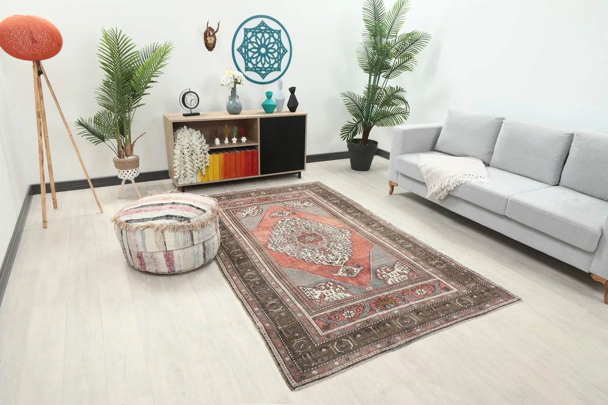 Angled view of the rose and gray area rug in a modern living space