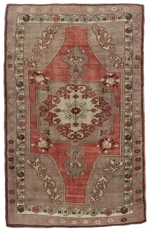 Full top view of the vintage rose and beige medallion rug on a white background