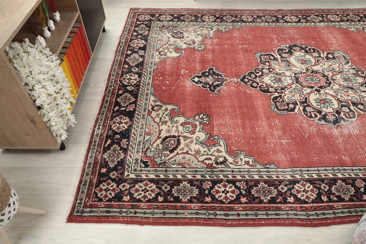 Overhead angle view of the rug, capturing its full design and colors in a room setting