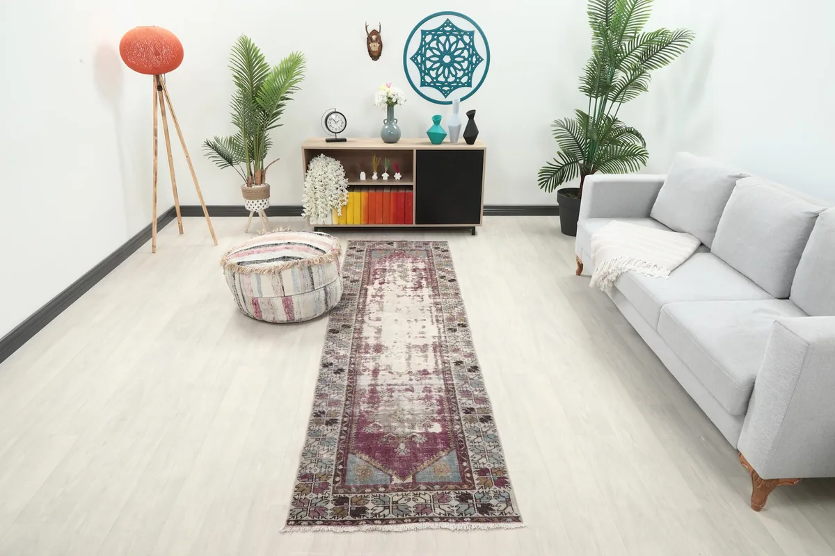 Runner rug displayed in a living room setting with a light gray sofa and wooden furniture