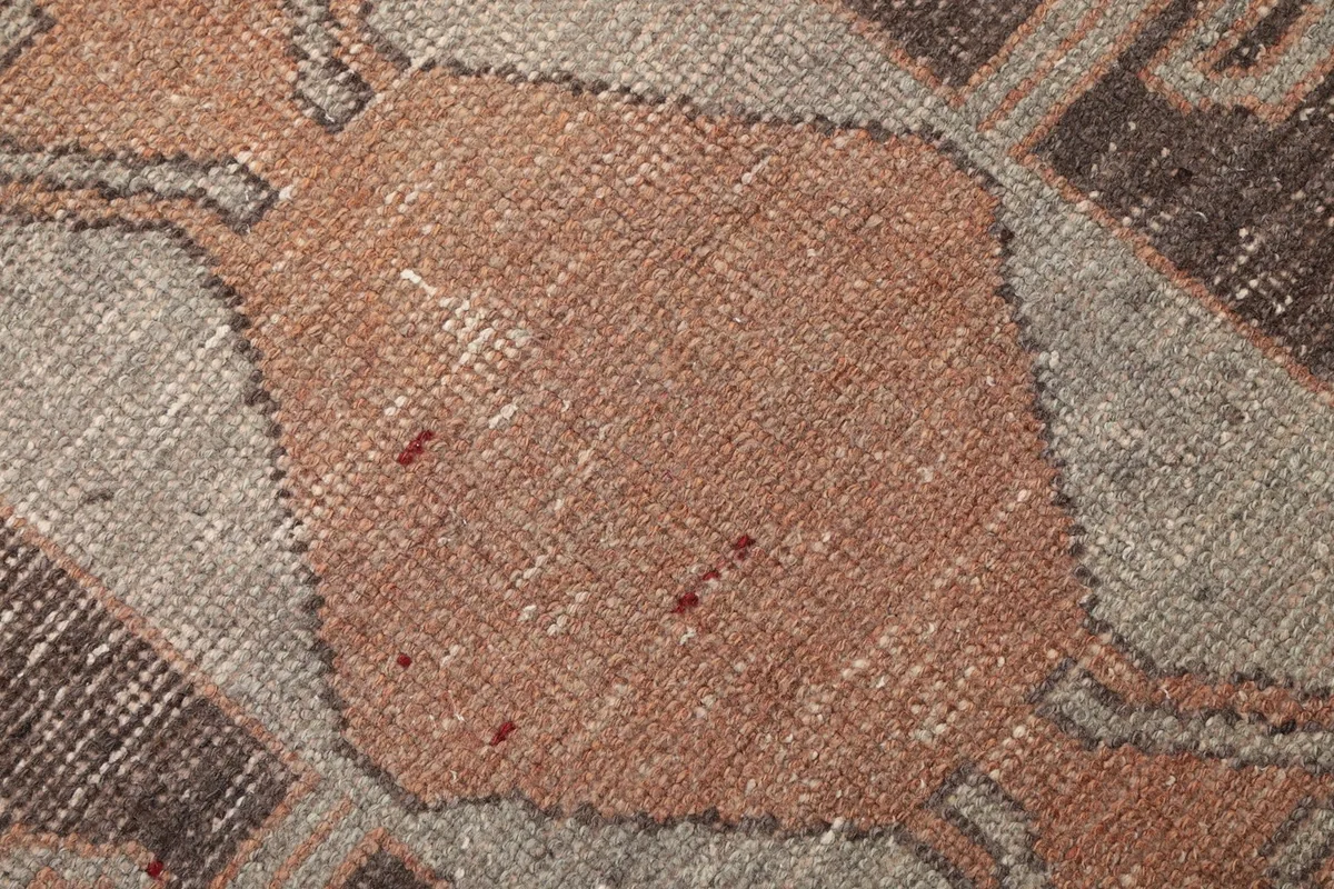 Texture close-up of the wool pile, showing the hand-knotted weave and subtle color variations