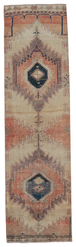Full overhead view of the vintage Anatolian runner rug with beige, rust, and navy geometric patterns