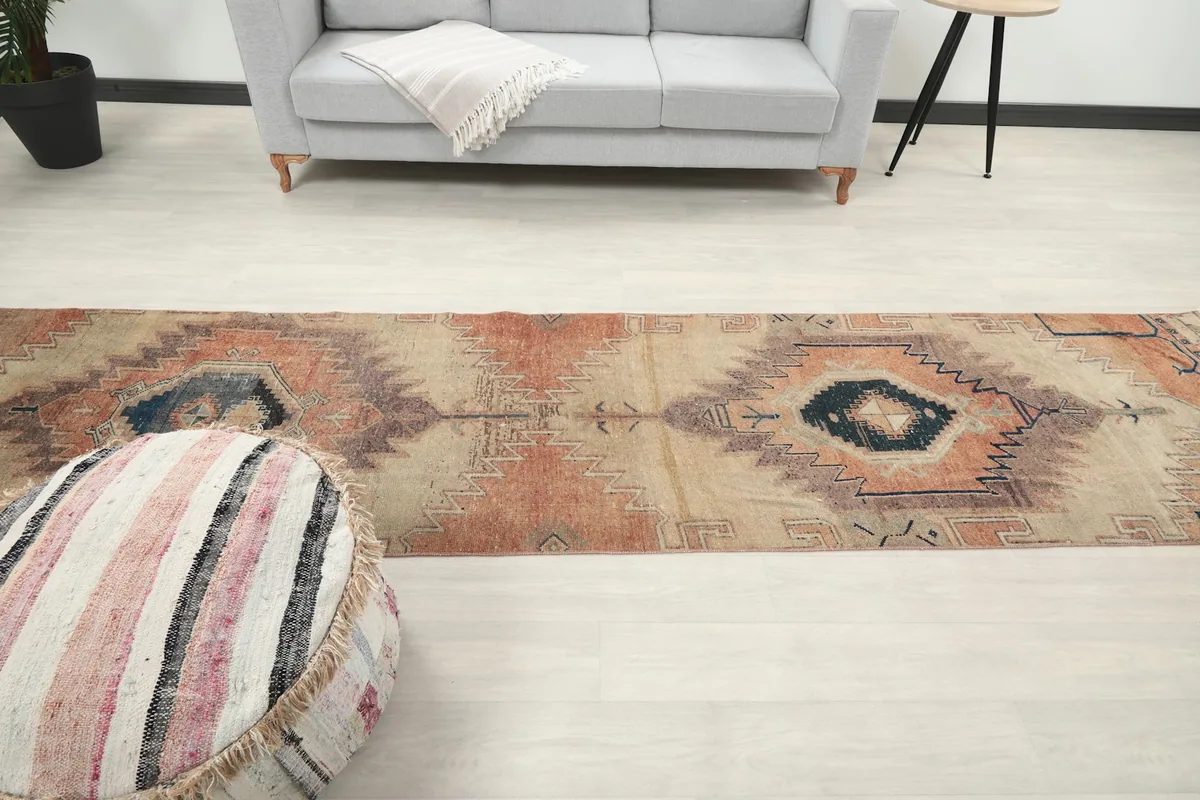 Overhead view of the rug in the room, emphasizing its length and the flow of its design