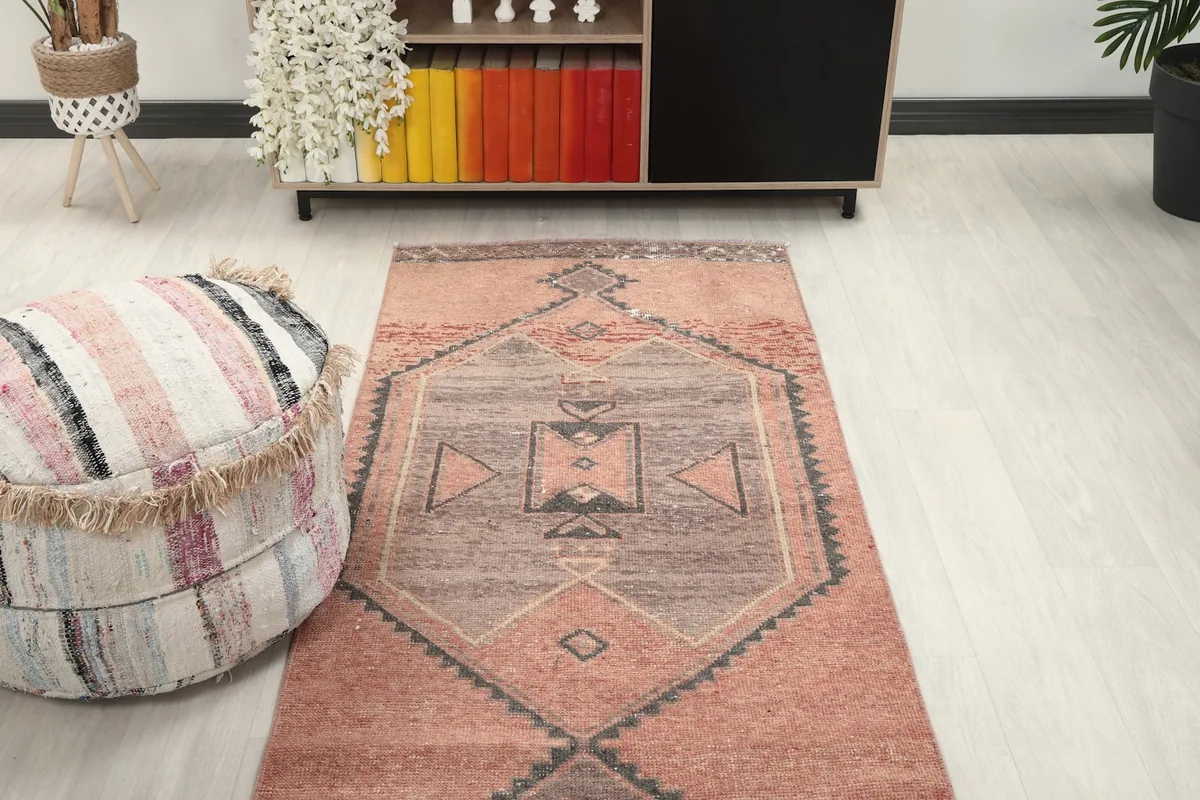 Overhead view showing one end of the runner rug with a geometric pattern in a room