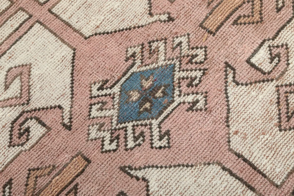 Macro shot of the wool pile showing the texture and colors within the medallion's center