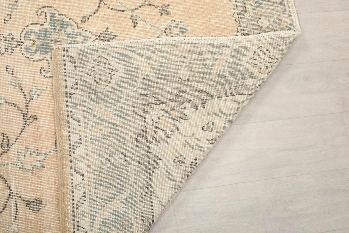 Close-up of the rug's underside, showing the reverse of the patterns and tight knotting
