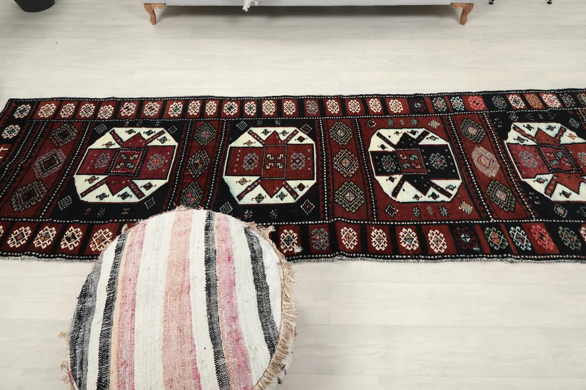 Overhead view of the full length of the runner rug, showcasing its distinct medallions