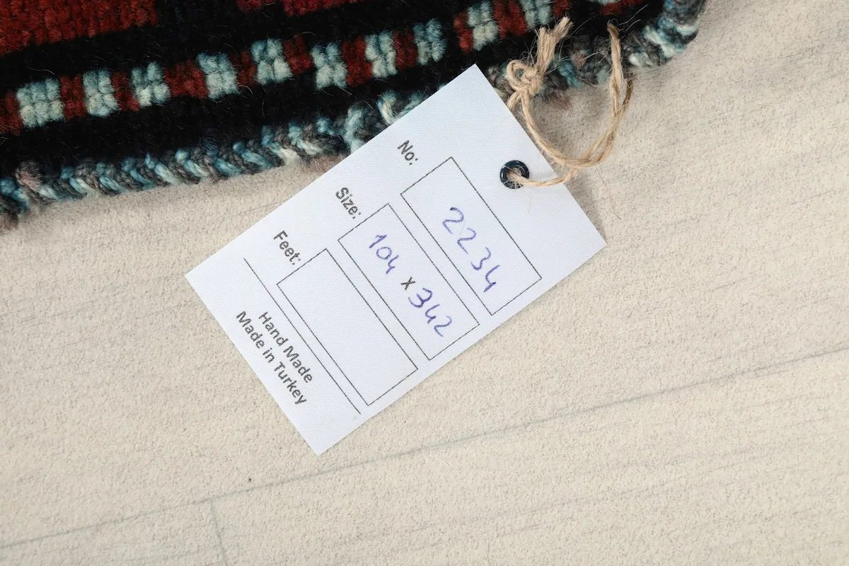 Tag showing the dimensions of the hand-made in Turkey rug