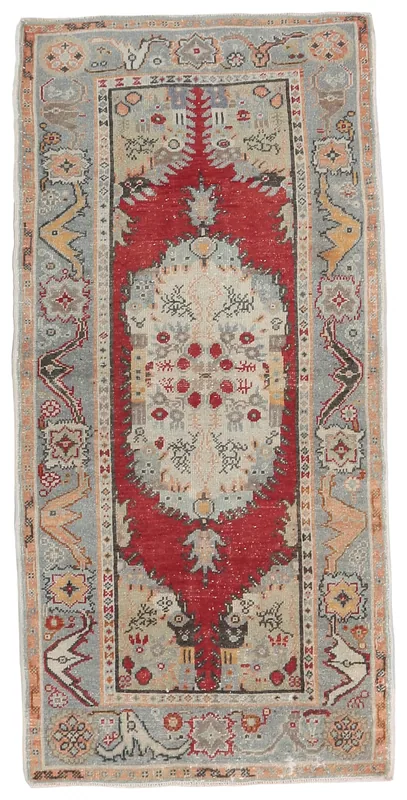 Full top view of the 3x6 vintage Anatolian rug with red medallion and beige field