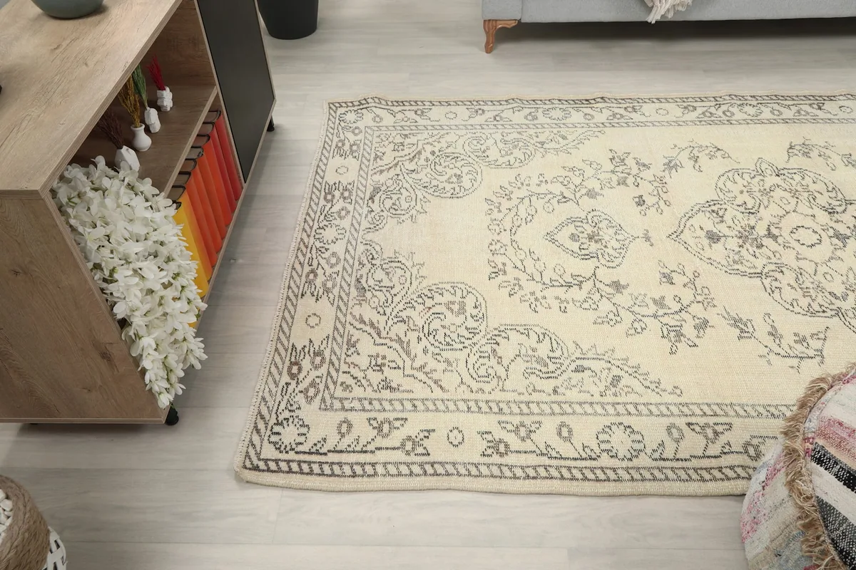 Angled shot of the rug's lower half, showing its placement relative to furniture