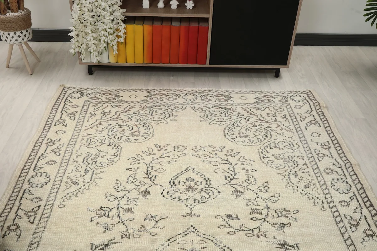Overhead view of the rug in a room, highlighting the upper portion and furniture