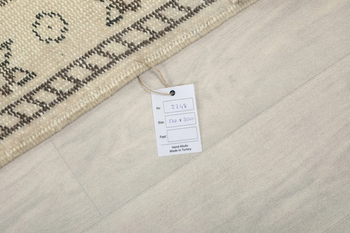 Rug tag displaying product information against the rug's edge