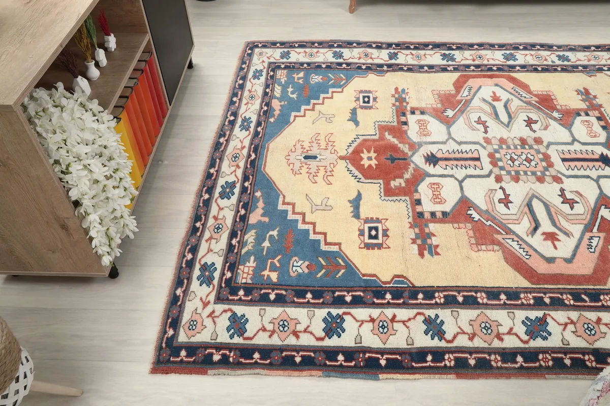 Wide-angle view of the rug on the floor, capturing its full length and width in a room setting
