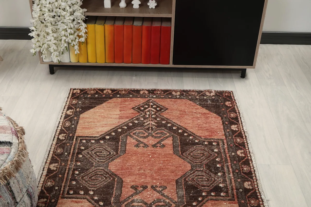 Overhead view of a section of the runner rug in a room setting, focusing on the patterns.