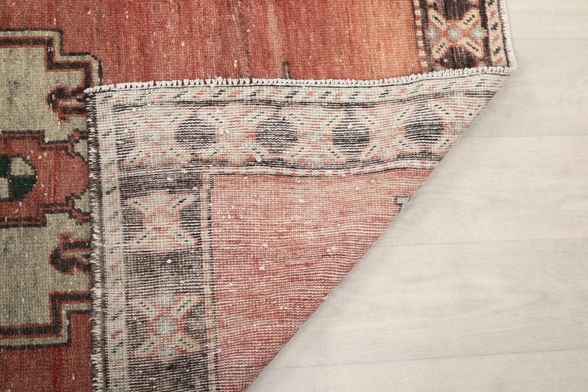 Another view of the rug's underside, revealing the weaving and vintage patina
