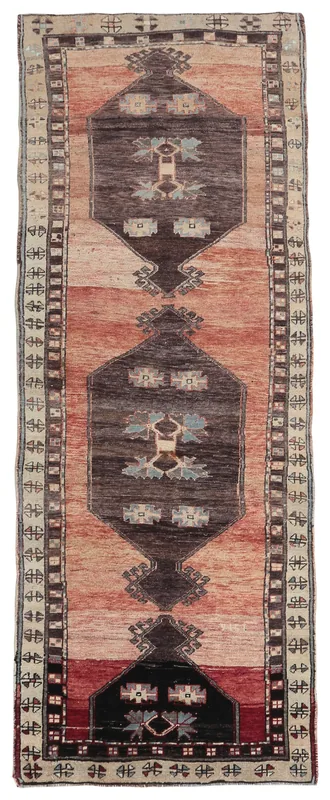 Full top view of the 3'7" x 9'7" vintage Anatolian runner rug with rust and brown geometric patterns.