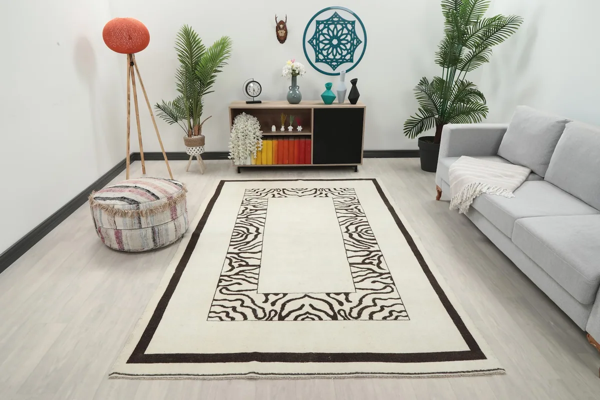 Vintage Anatolian rug displayed in a living room setting, showing its scale and design