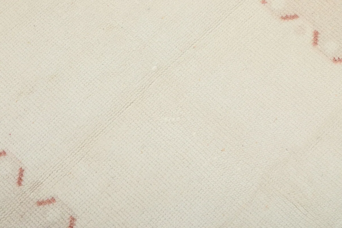 Close-up of the low wool pile and weave texture of the rug