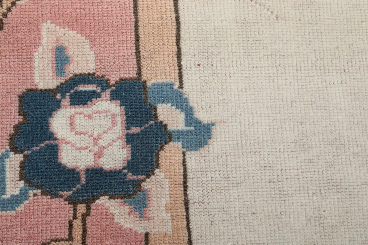 Close-up of the hand-knotted wool pile and cotton foundation showing weave detail