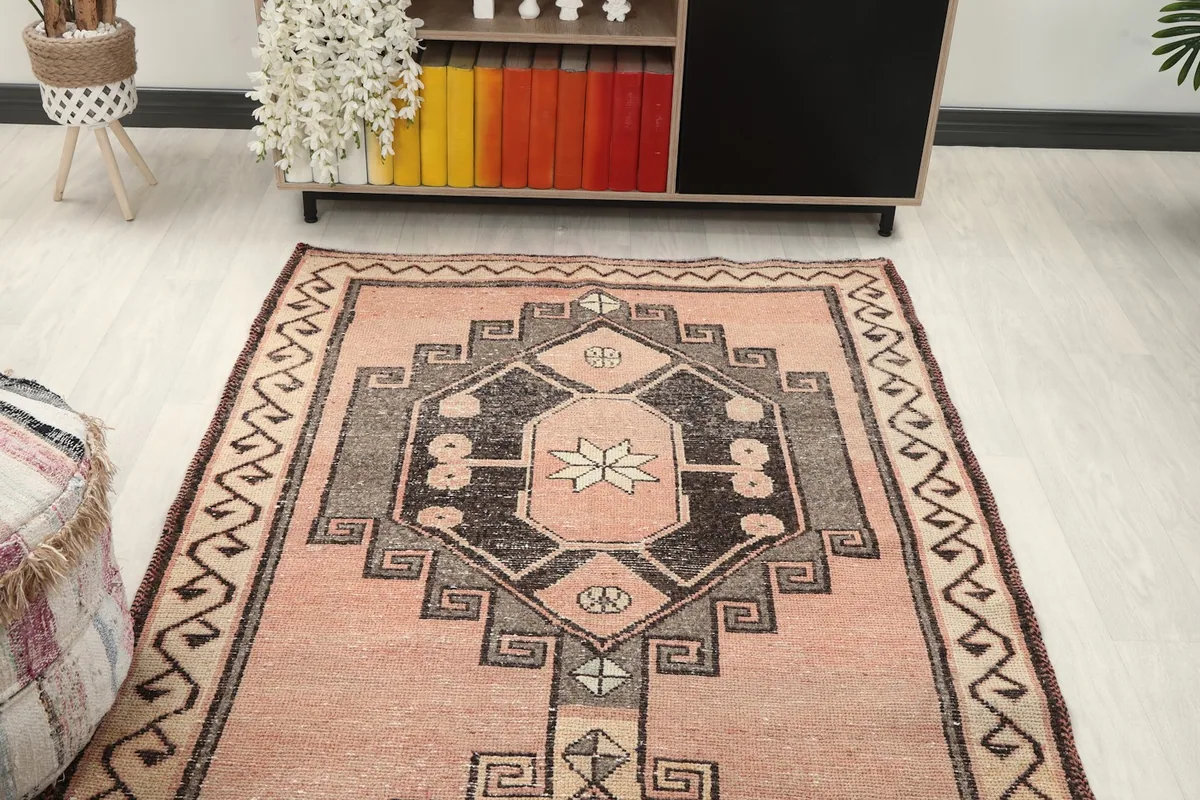 Overhead perspective of the runner rug in a room, highlighting the repeating medallion design.