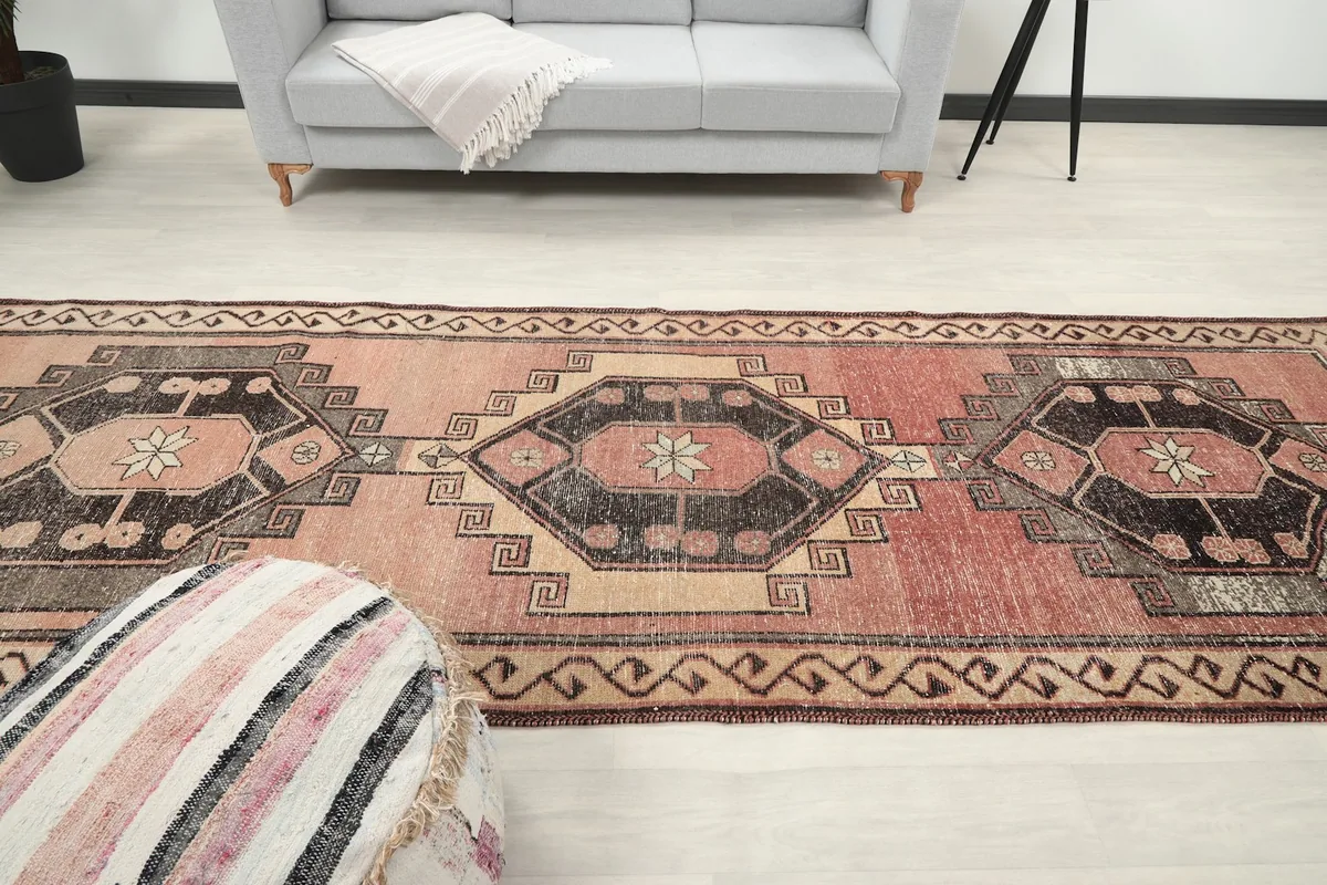 Longitudinal view of the runner rug in the room, emphasizing its length and pattern flow.